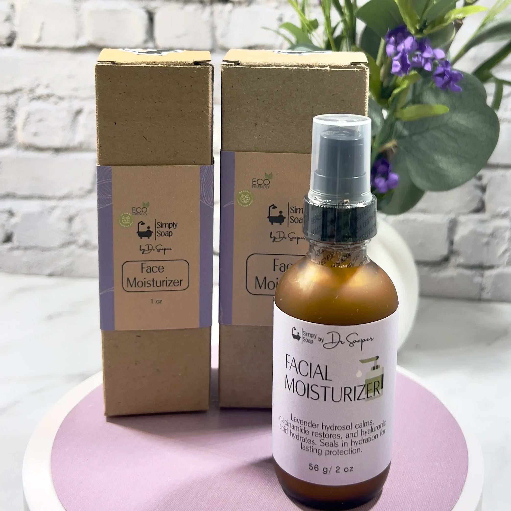 Facial moisturizer bottle and packaging on a white surface with a plant in the background