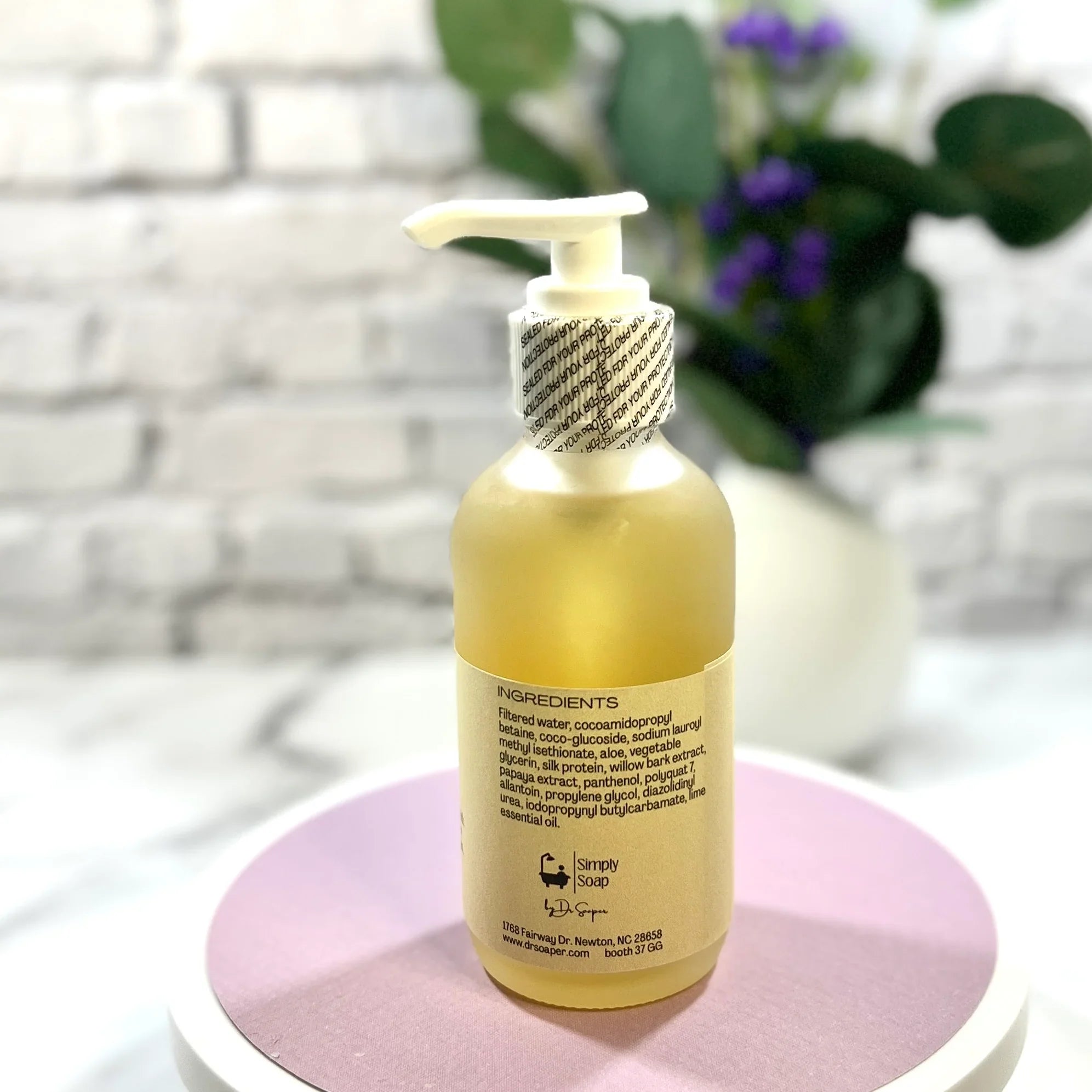 Facial wash bottle, back. Ingredients shown