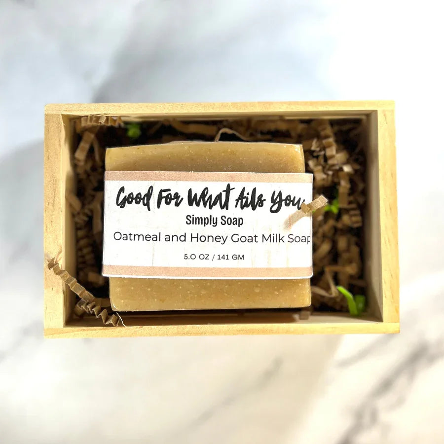 Bar of soap in a wooden box with a label on a light background