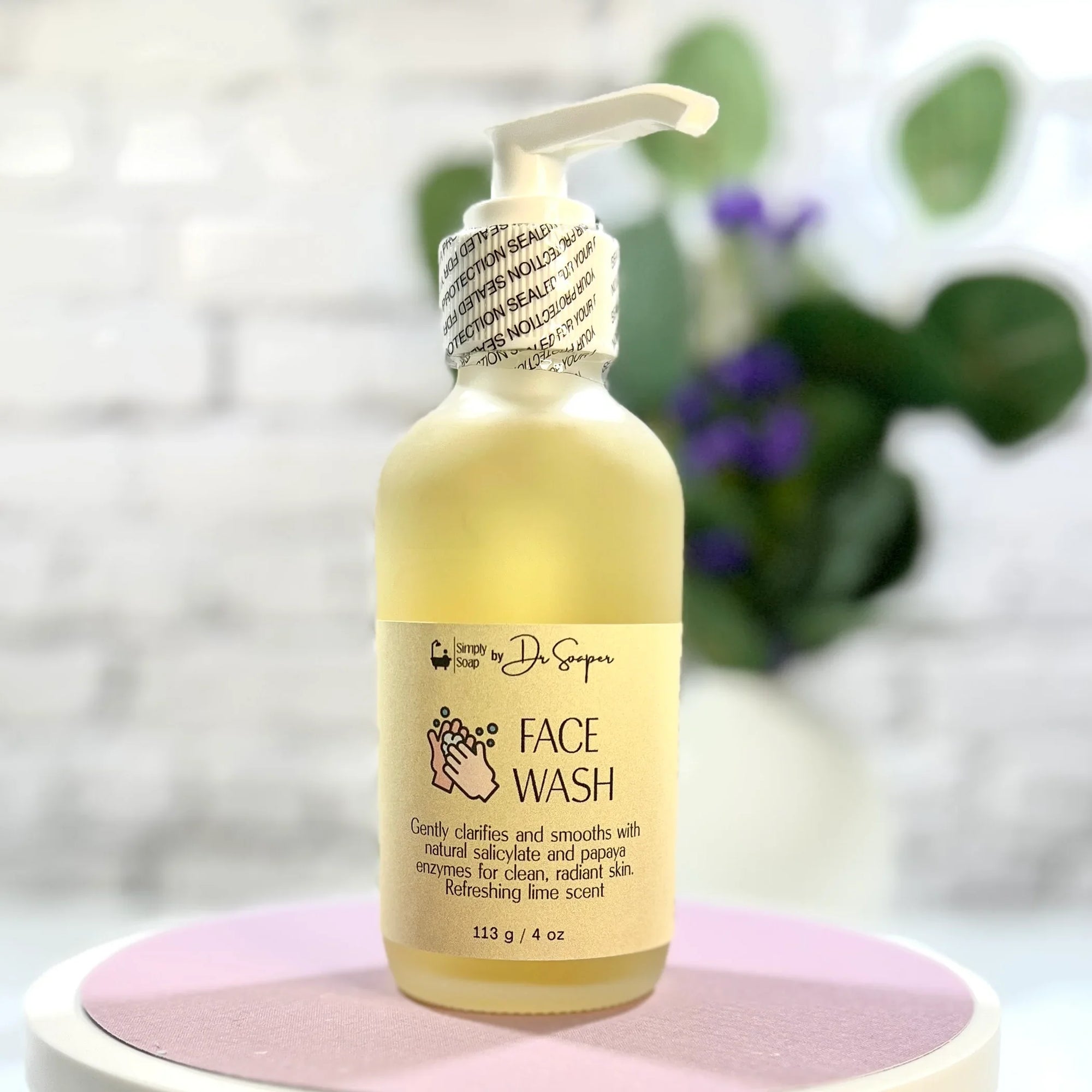 Face Wash with pump front view, blurry background