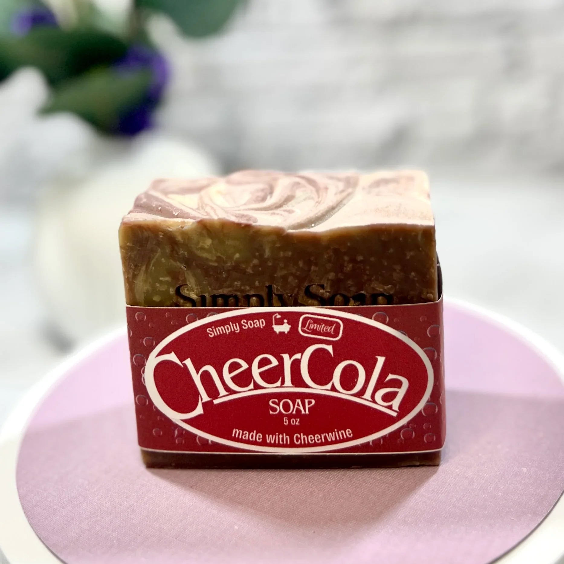 Cheer Cola soap front view on pink tabletop