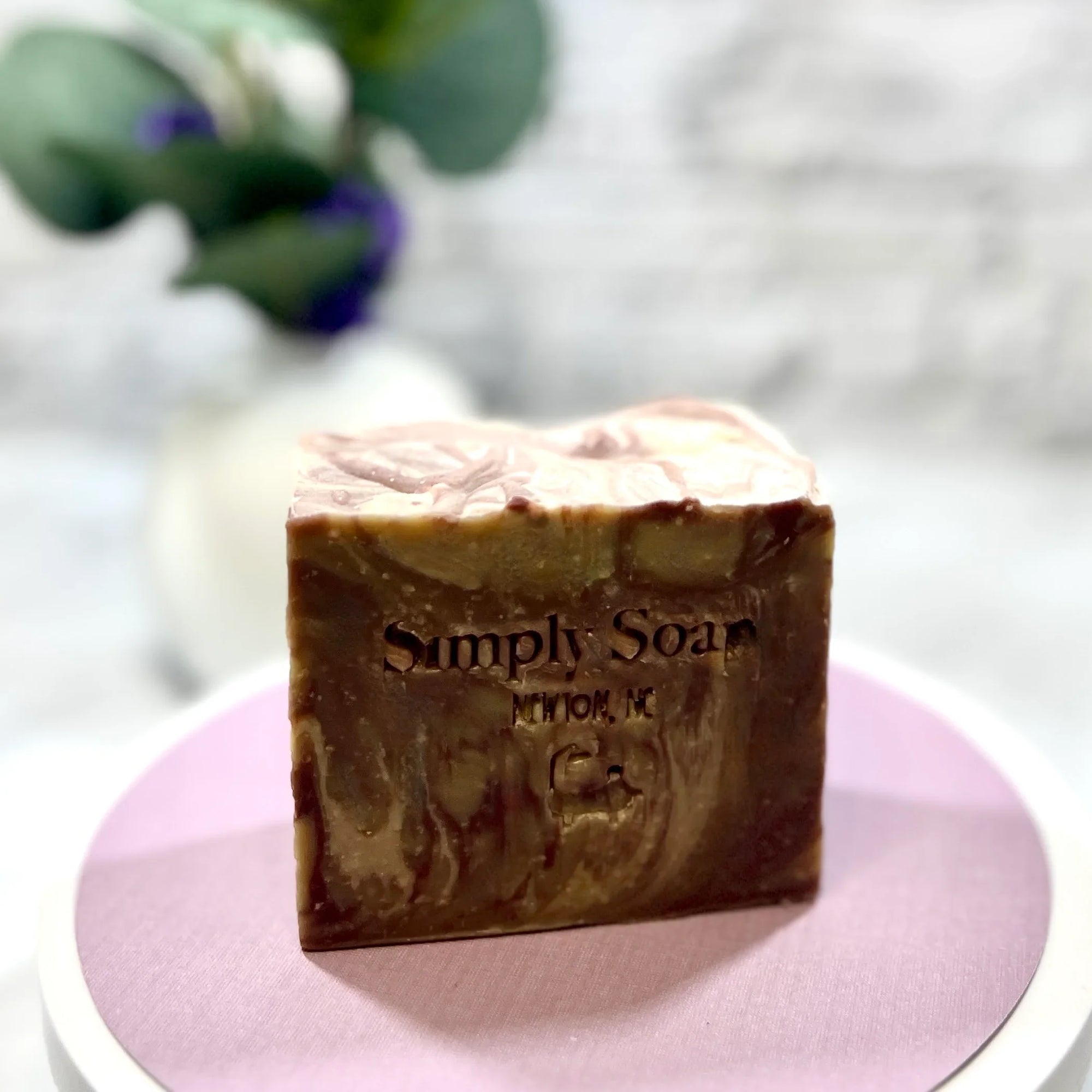 Cheer Cola soap with no label on pink tabletop