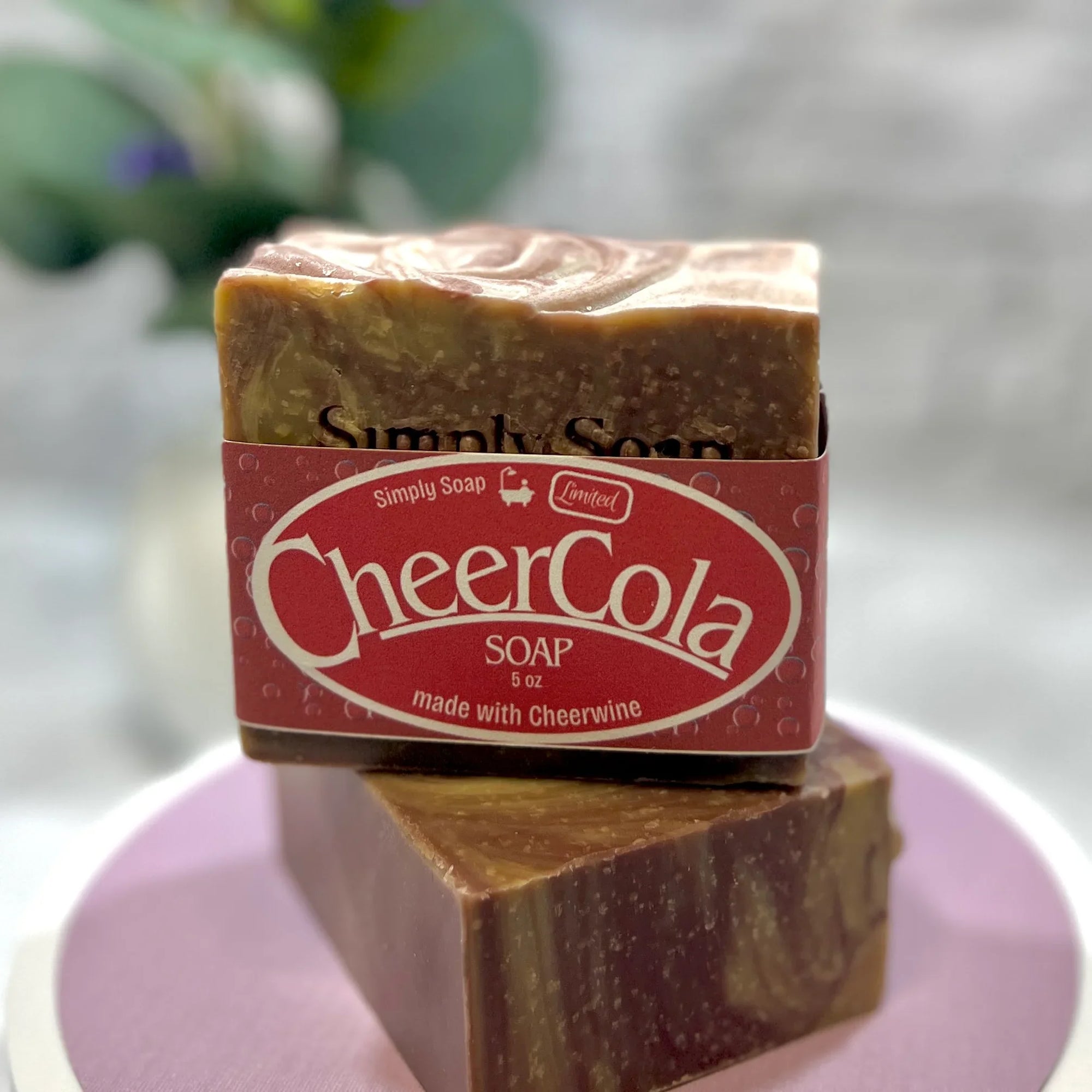 Cheer Cola 2 bars stacked front view on pink tabletop