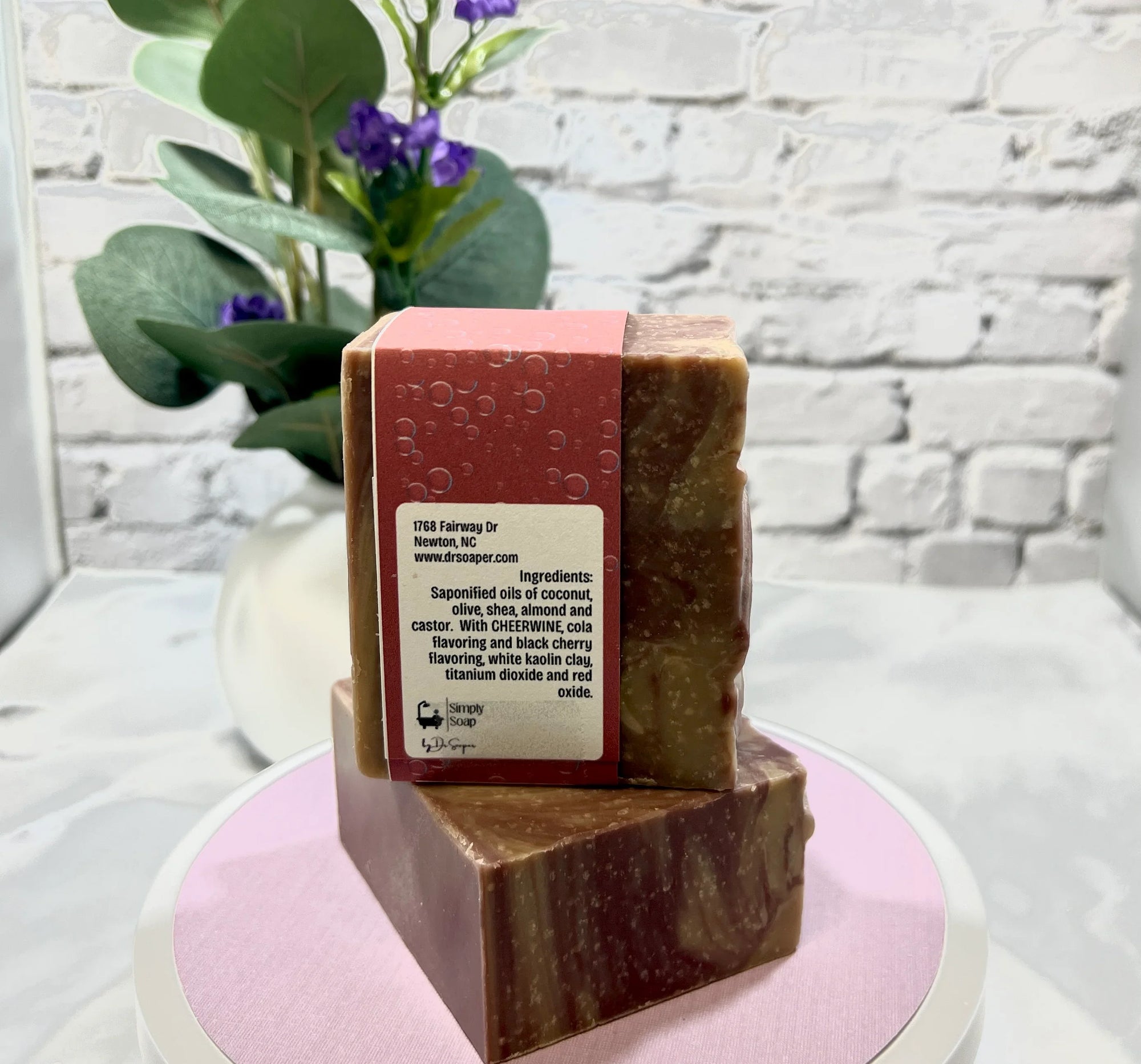 Cheer Cola soap ingredient view on pink tabletop