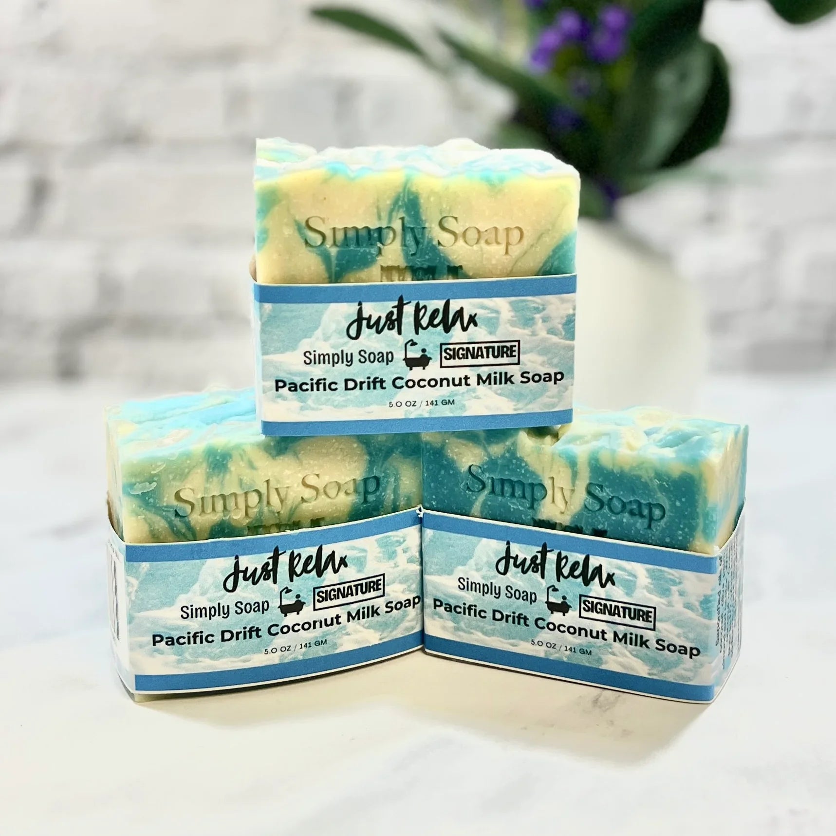 Four bars of 'Simply Soap' with 'Just Relax' branding on a light background.