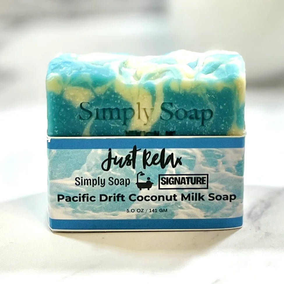 Bar of Pacific Drift  Soap with blue swirls on a white background