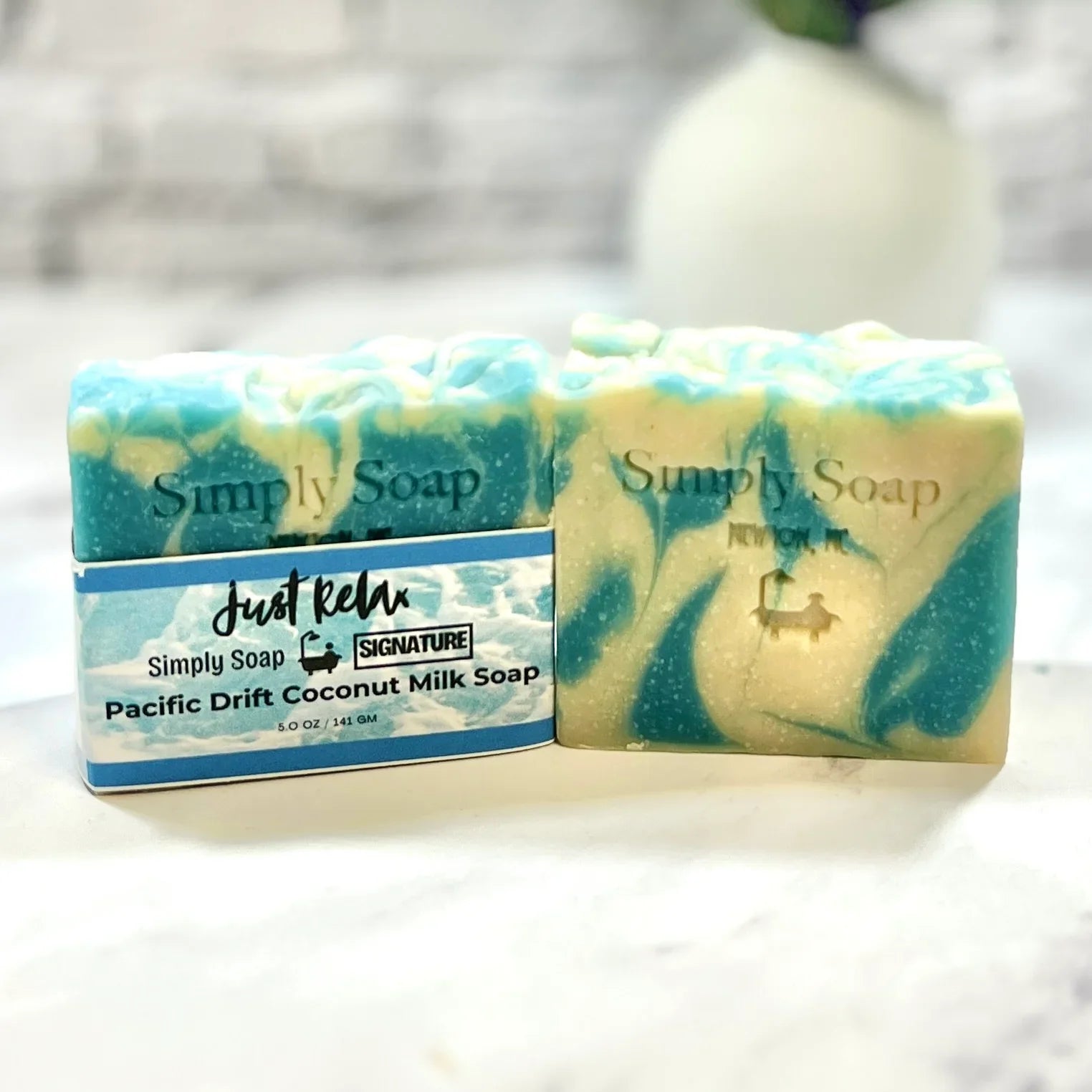 Two bars of Pacific Drift Soap with a visible label on a white surface