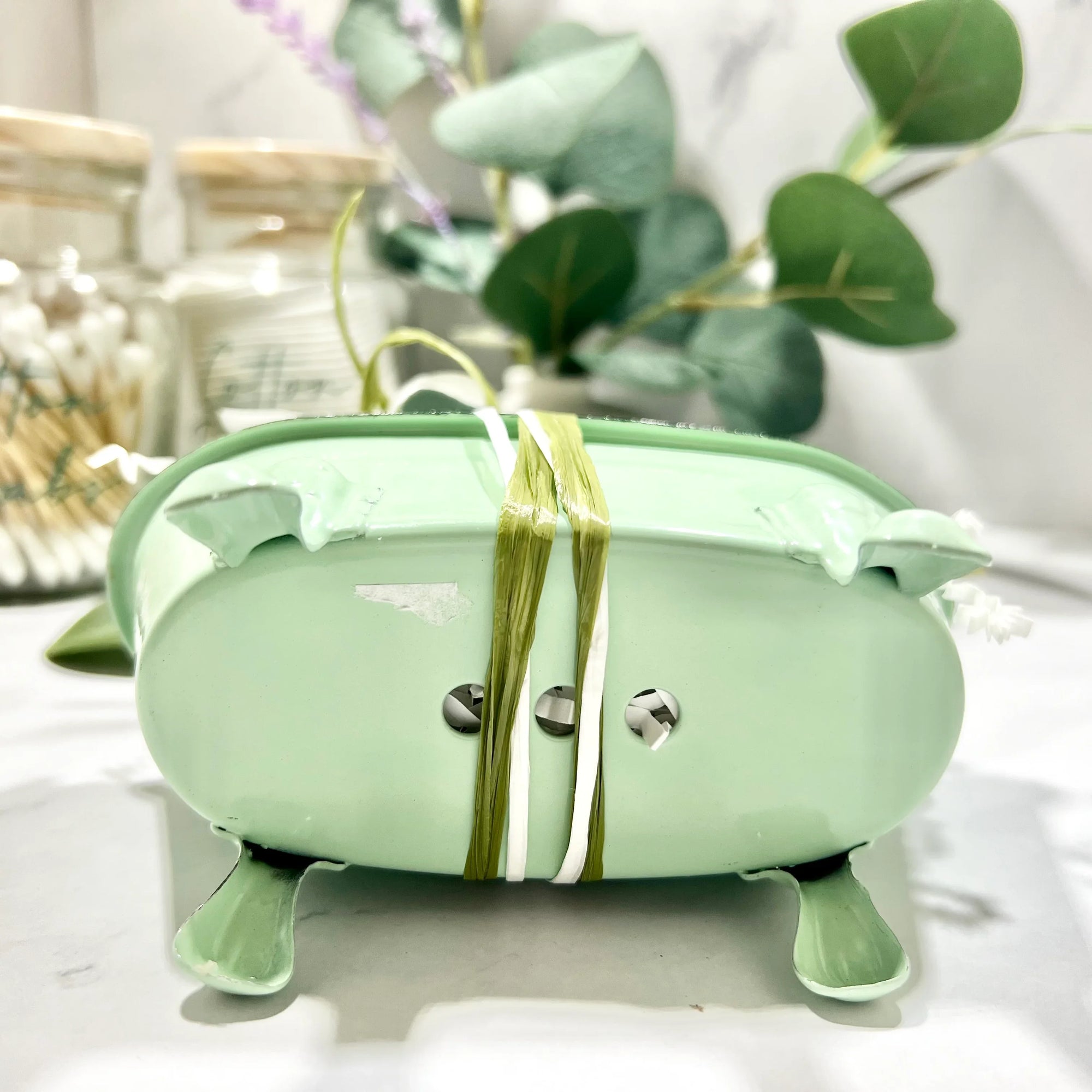 Soap in Bathtub green tub on it's side showing drainage