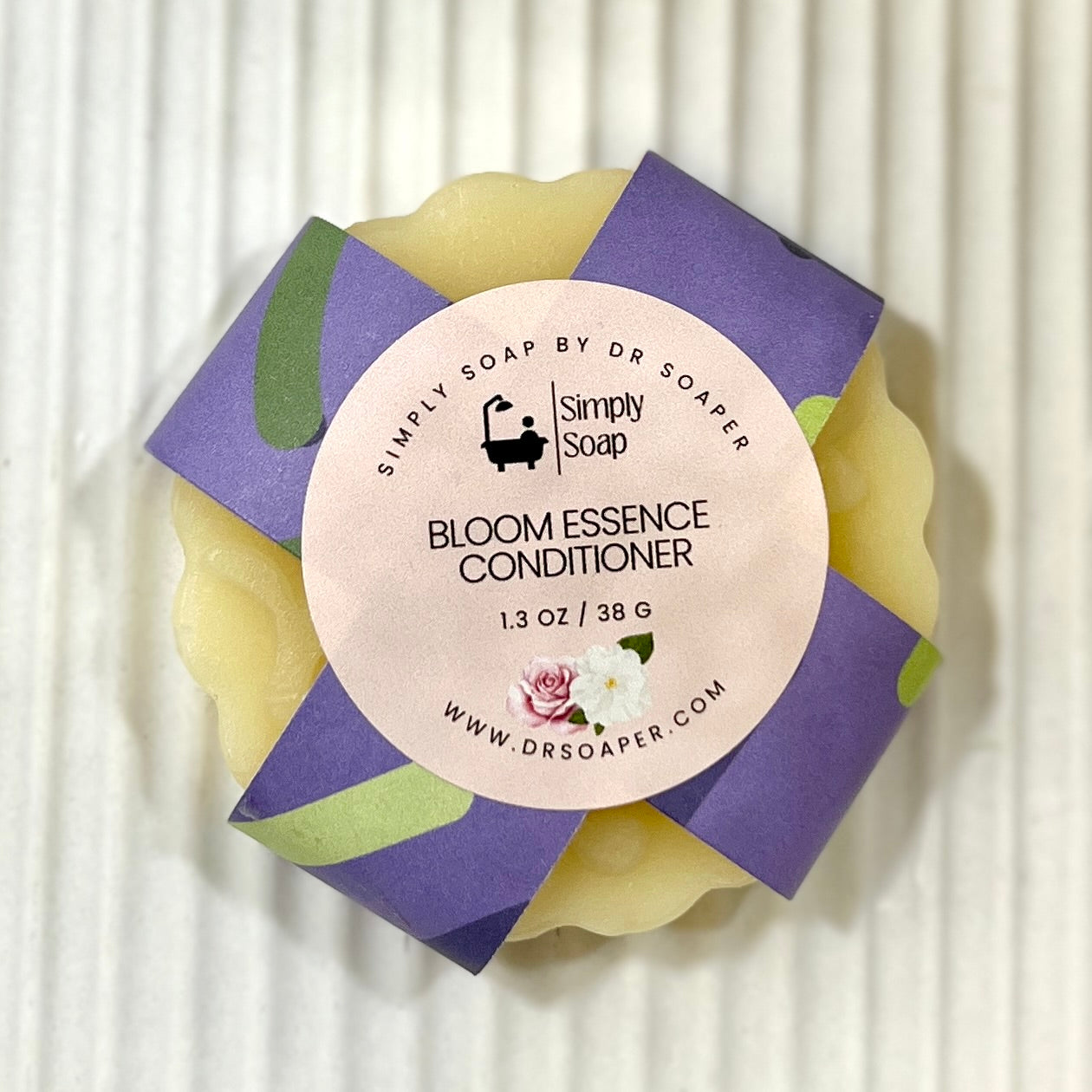 Bloom Essence Conditioner bar on white background