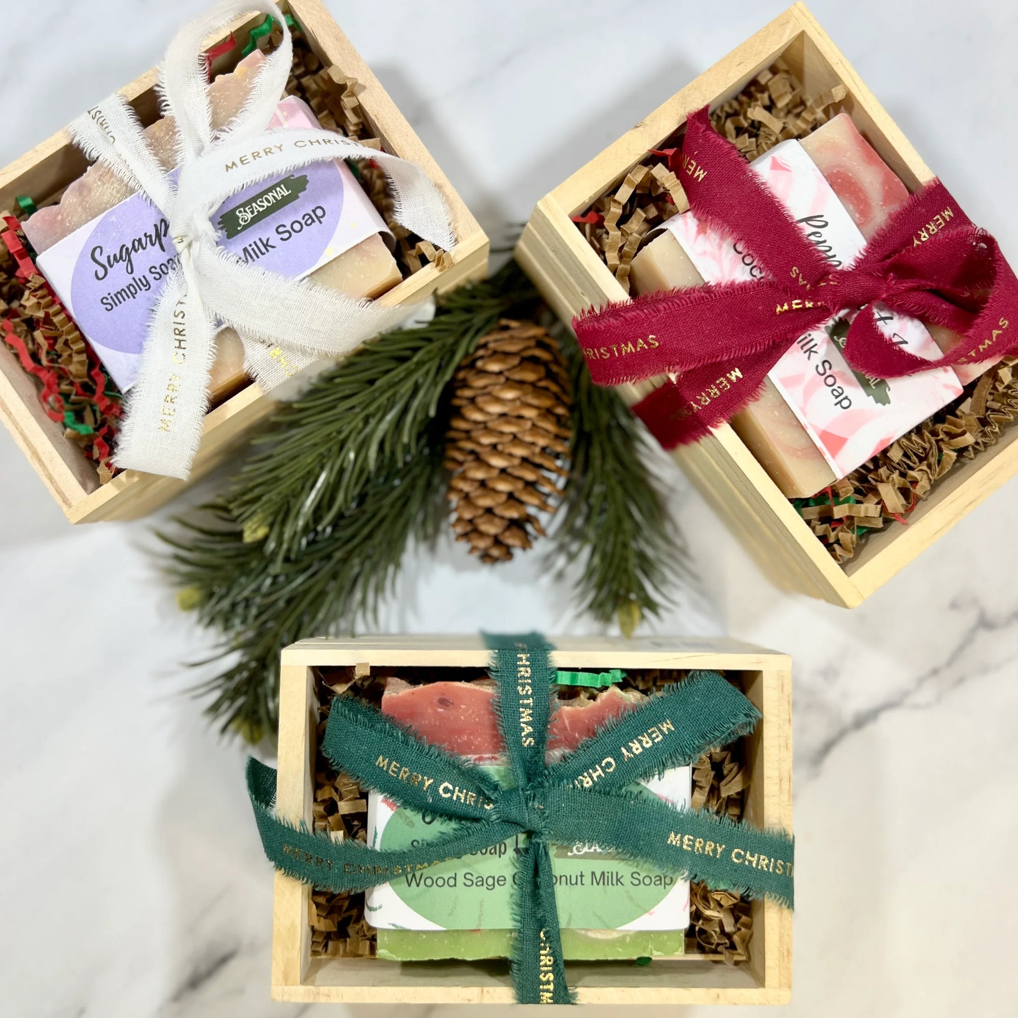 Christmas soap in wooden crate and wrapped with Merry Christmas ribbon in different colors