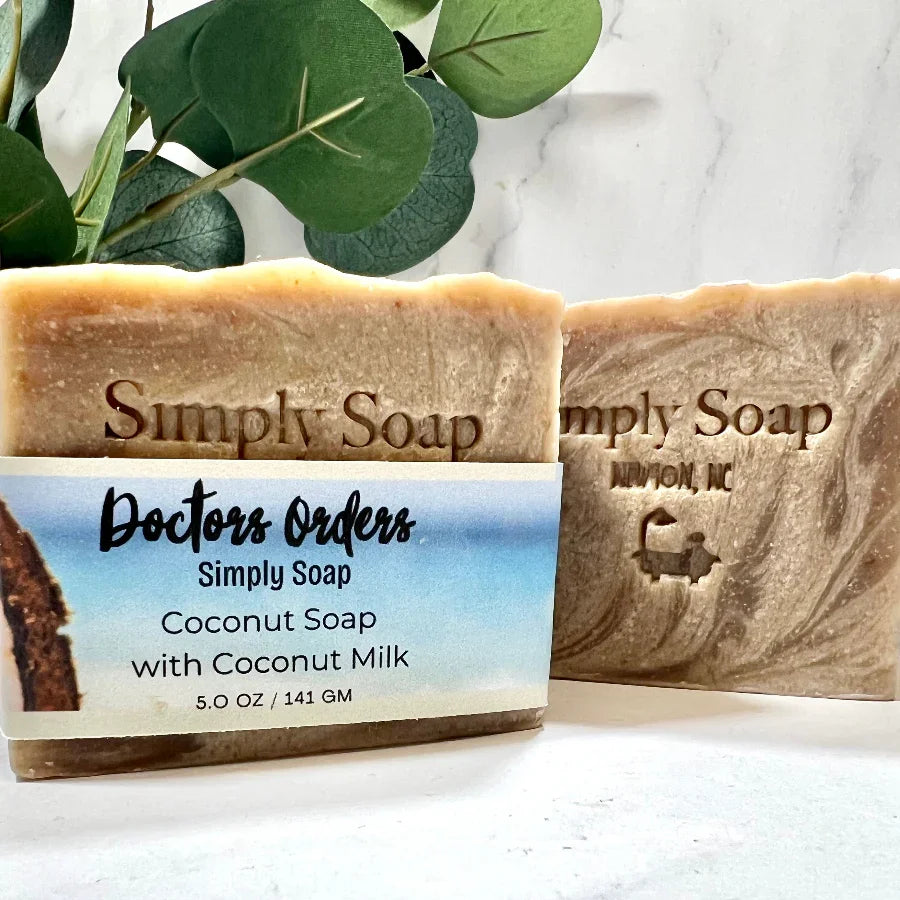 Dr. Soaper Coconut -Coconut Milk Soap bar on marble surface, 2 bars one with label, one without