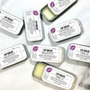 Dr. Soaper Natural Lip Balm tins, multiple with 2 tins open on marble background