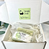 Dr Soaper's Customized soap on a clear glass dish in organza bag. Boxed in white box with crinkle