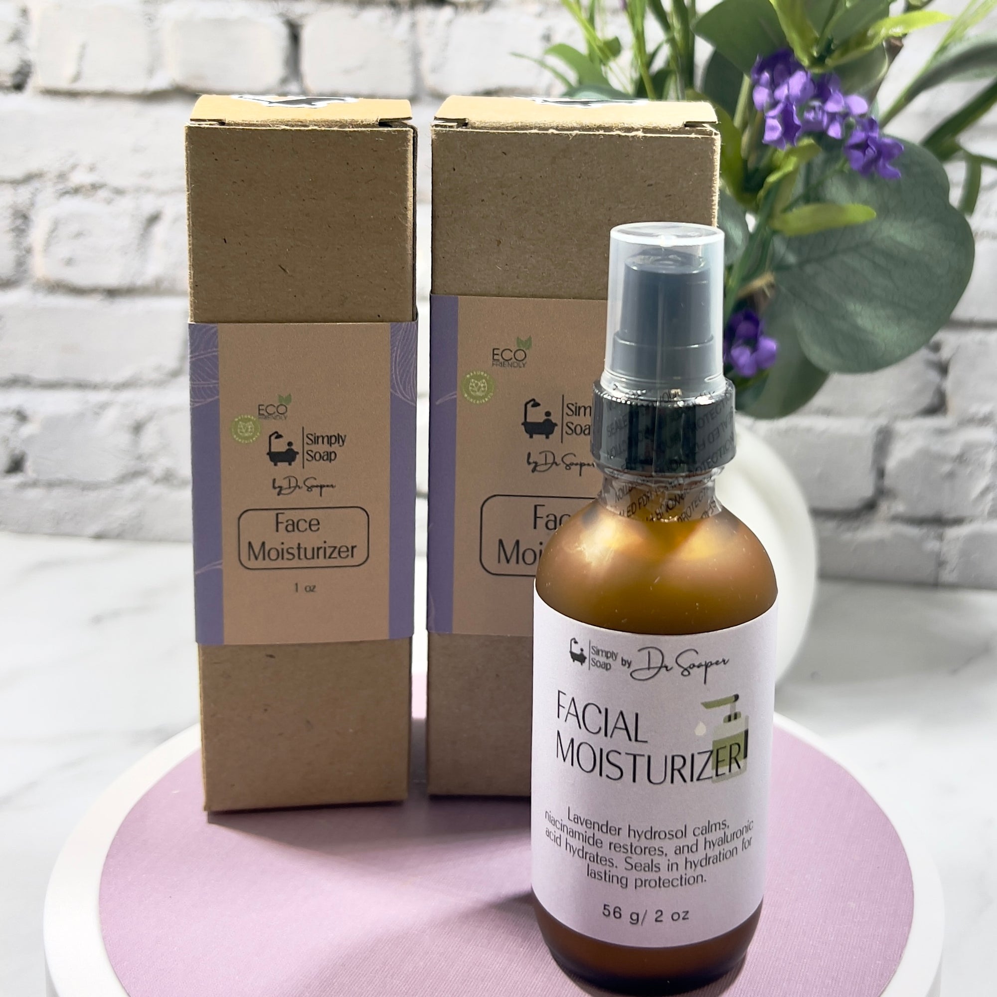 Facial moisturizer bottle and packaging on a white surface with a plant in the background