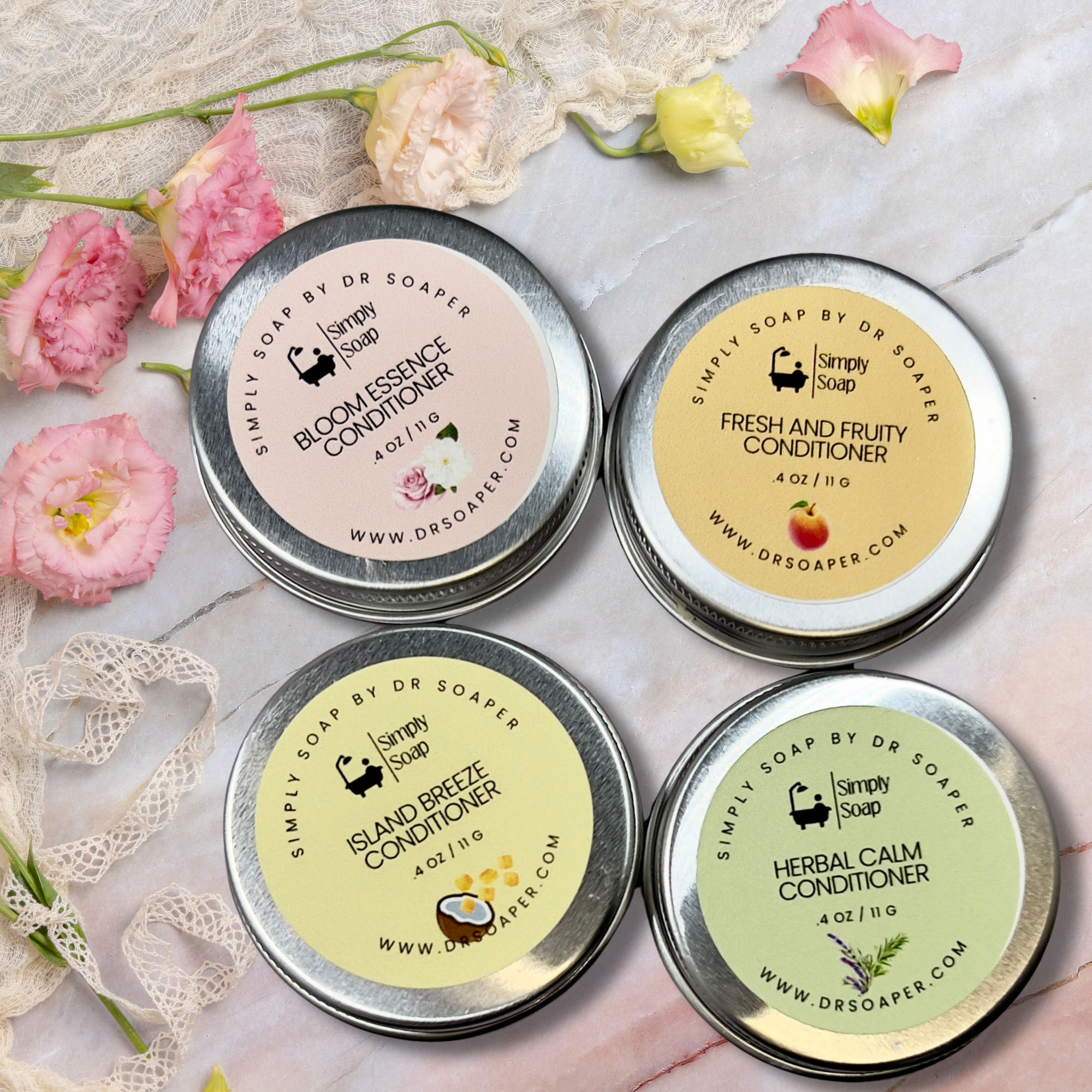 Four tins of Simply Soap by Dr. Soaper  solid conditioner bars with floral and decorative elements on a light background.