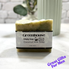 Bar of coconut milk soap with a 'Greenhouse' label on a white surface.