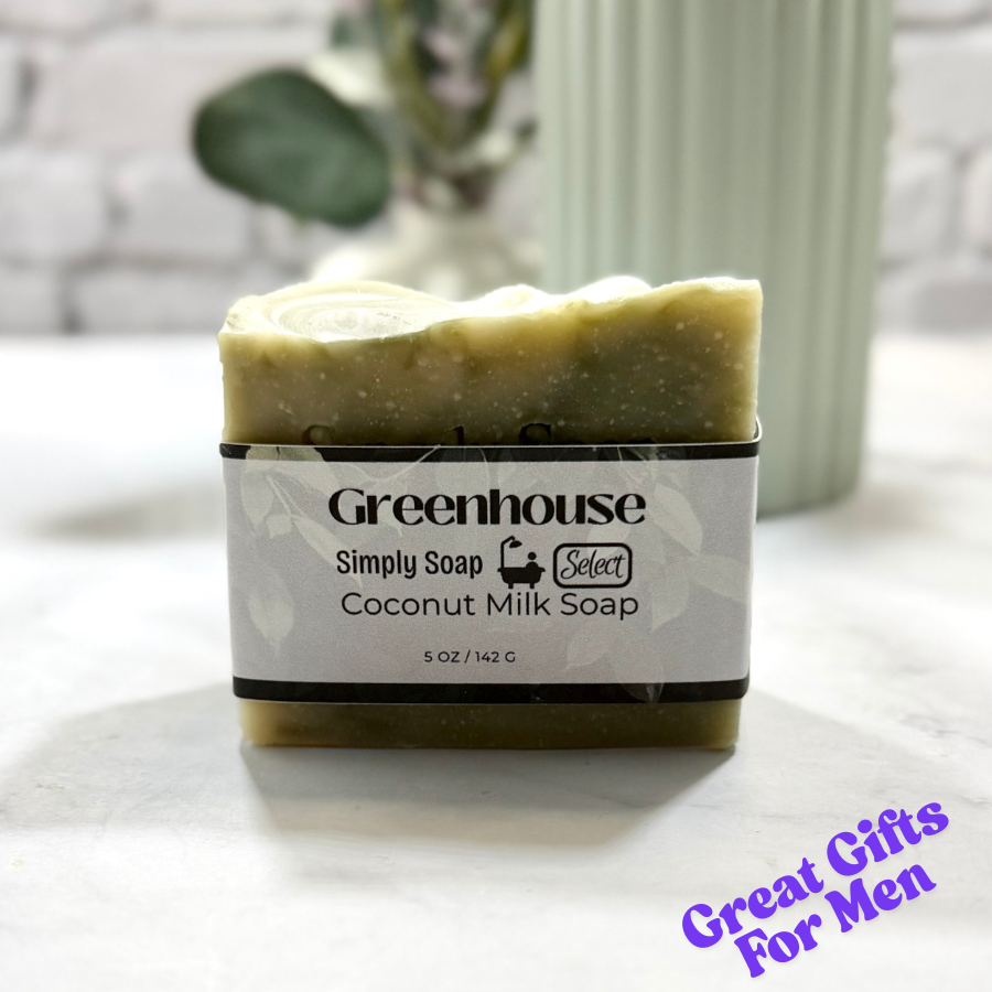 Bar of coconut milk soap with a 'Greenhouse' label on a white surface.