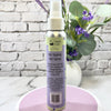 Hair styling salt spray bottle with a decorative background