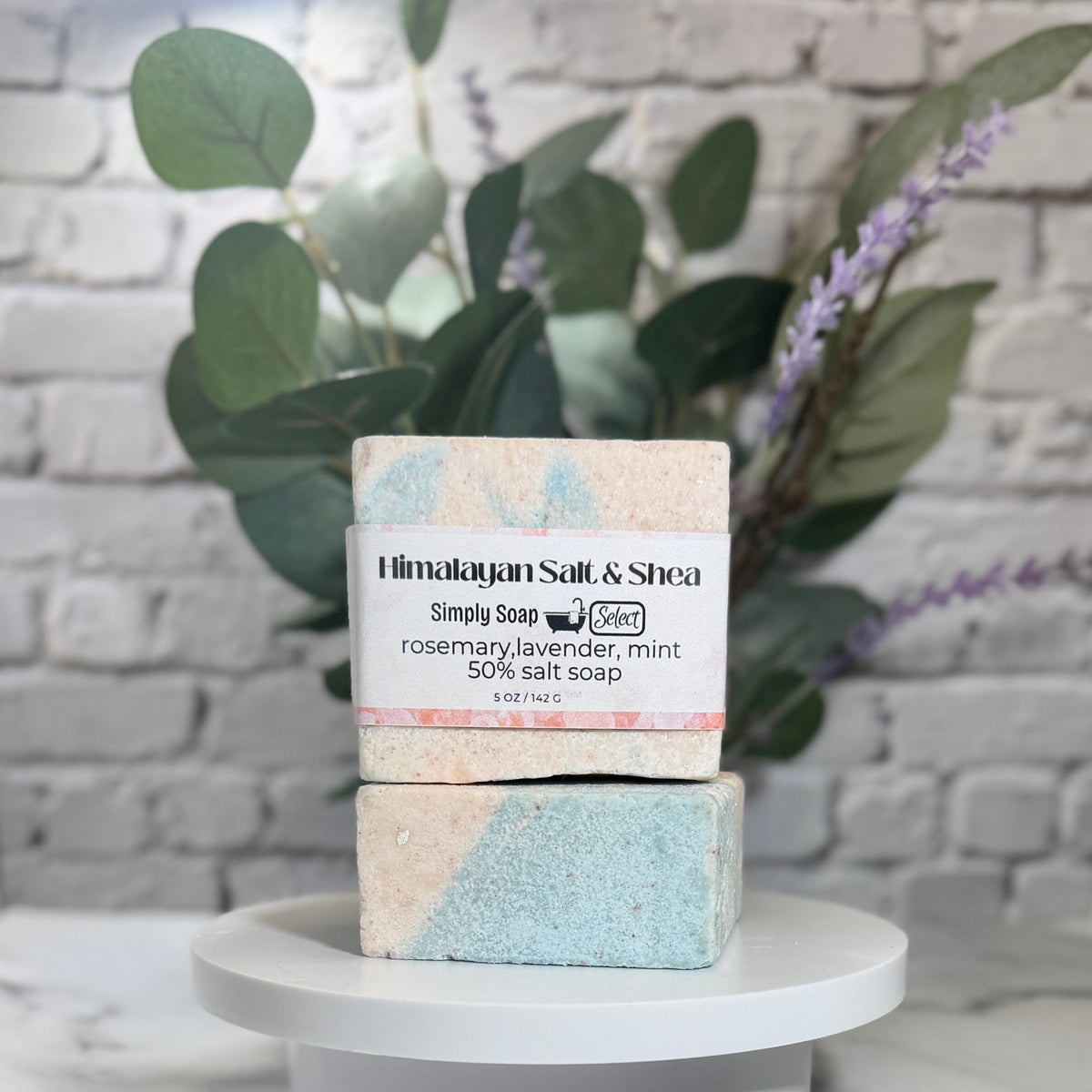 Himalayan Salt & Shea front view, with 2 stacked bars, in front of brick wall. 