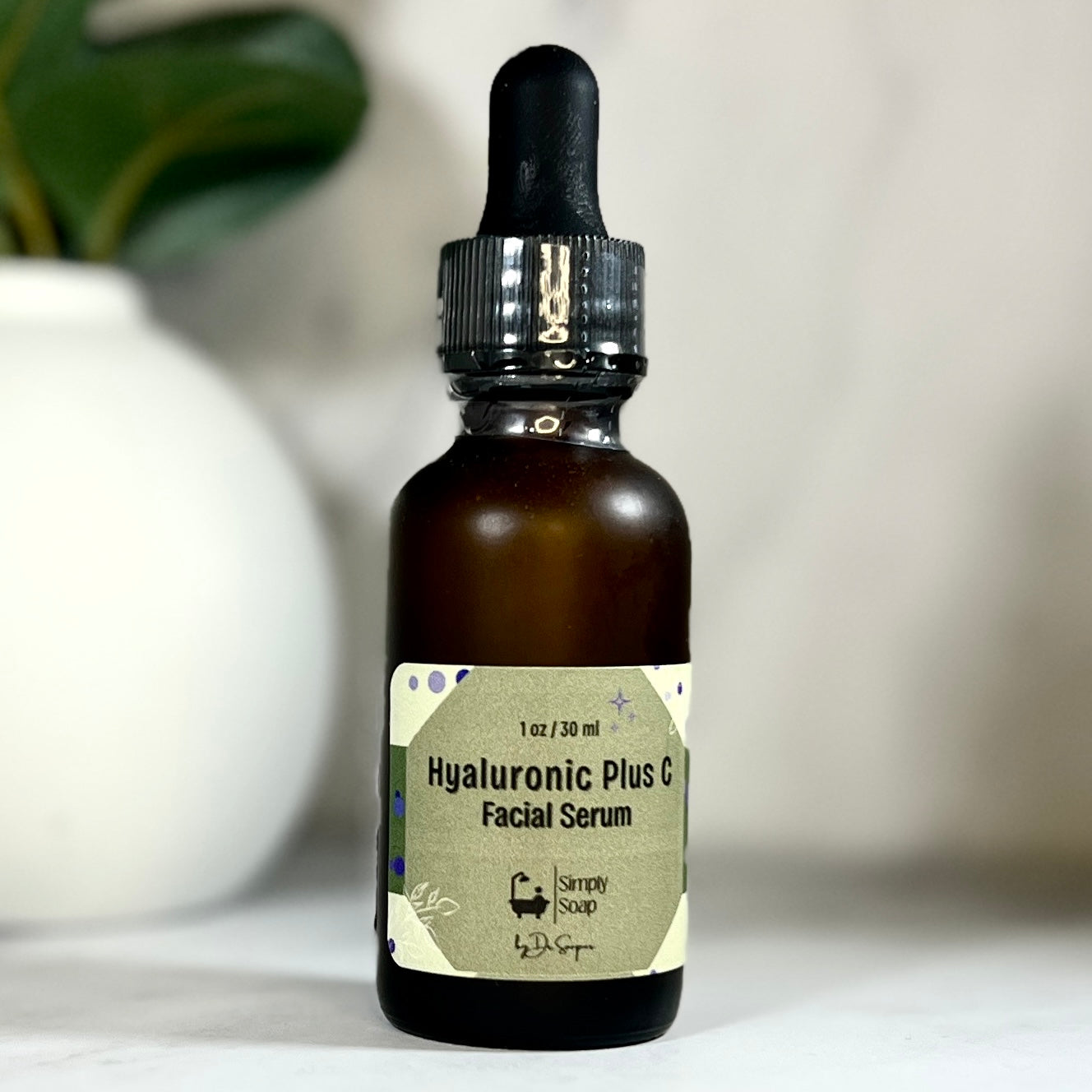 Hyaluronic + C Serum in glass bottle