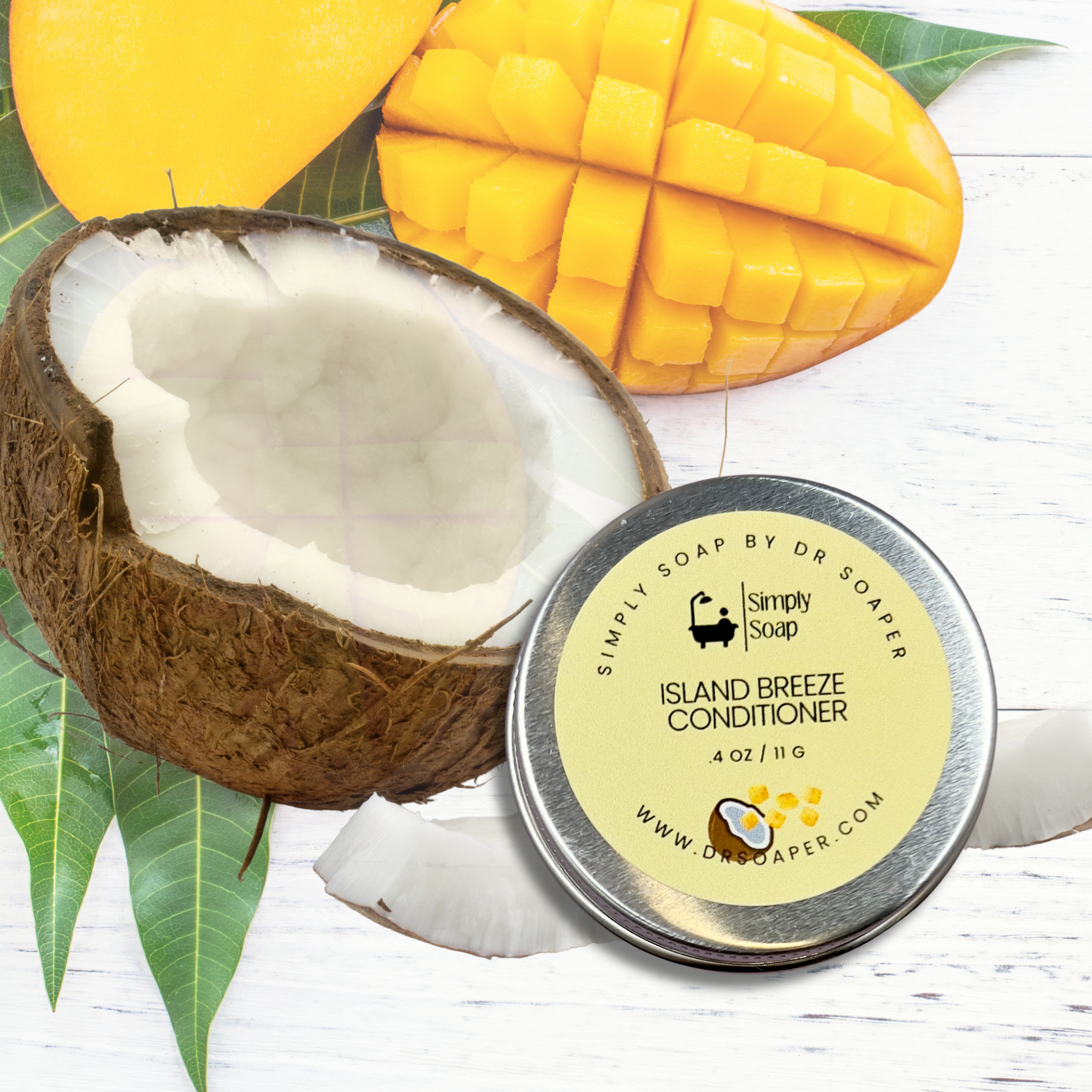 Simply Soap by Dr. Soaper Island Breeze Conditioner tin with a coconut and mango on a white wooden background