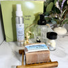 A curated realtor closing or housewarming gift set from Simply Soap with room spray, bar soap and soap dish, foaming soap pump and soap tab refills. 