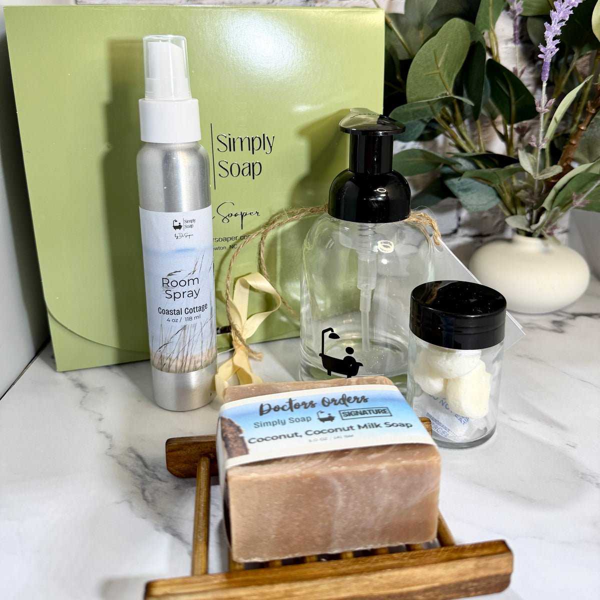 A curated realtor closing or housewarming gift set from Simply Soap with room spray, bar soap and soap dish, foaming soap pump and soap tab refills. 
