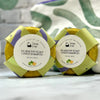 Two packages of RX Healthy Scalp Citrus Shampoo by Simply Soap on a white surface with a green leafy background.