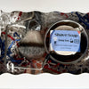 Shave brush and soap set with decorative packaging on a white background