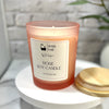 Single Rose Soy Candle by Dr Soaper, with wooden lid on a marble surface 