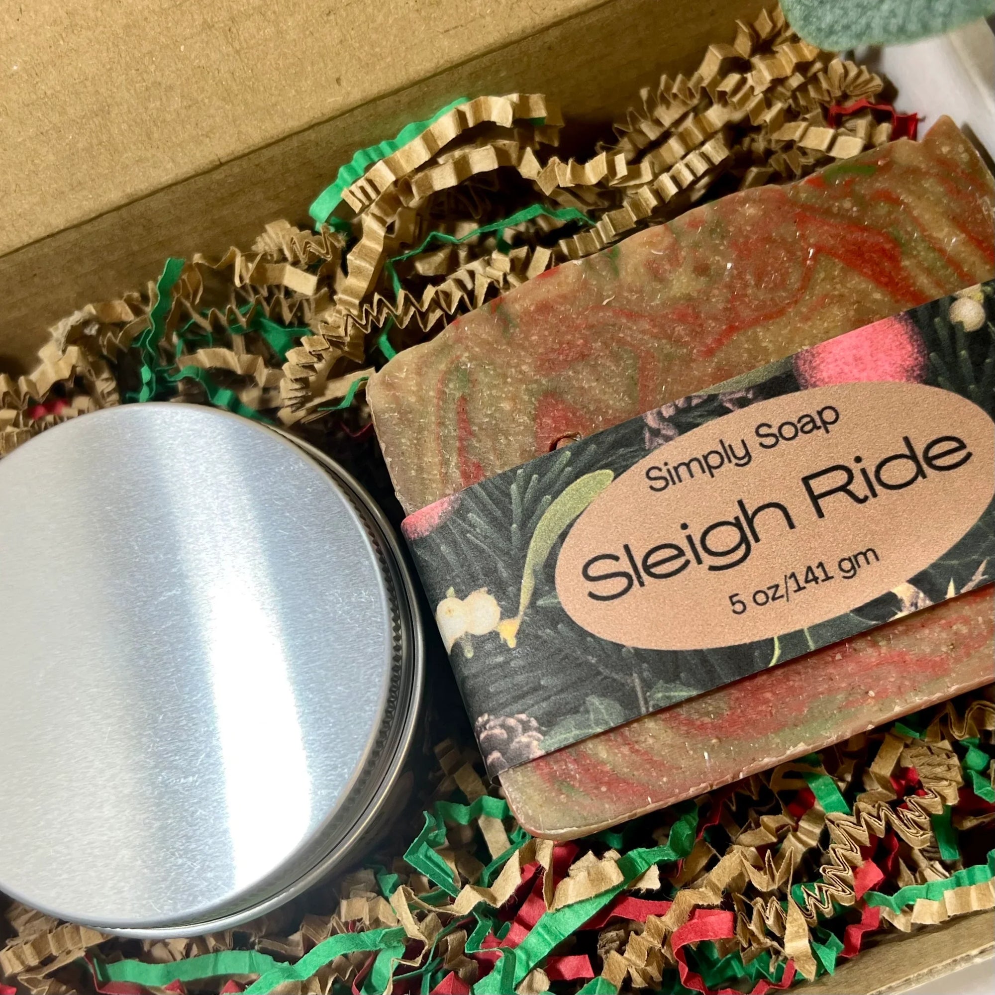 Sleigh ride cold process soap and soy candle in tin as seen from the top