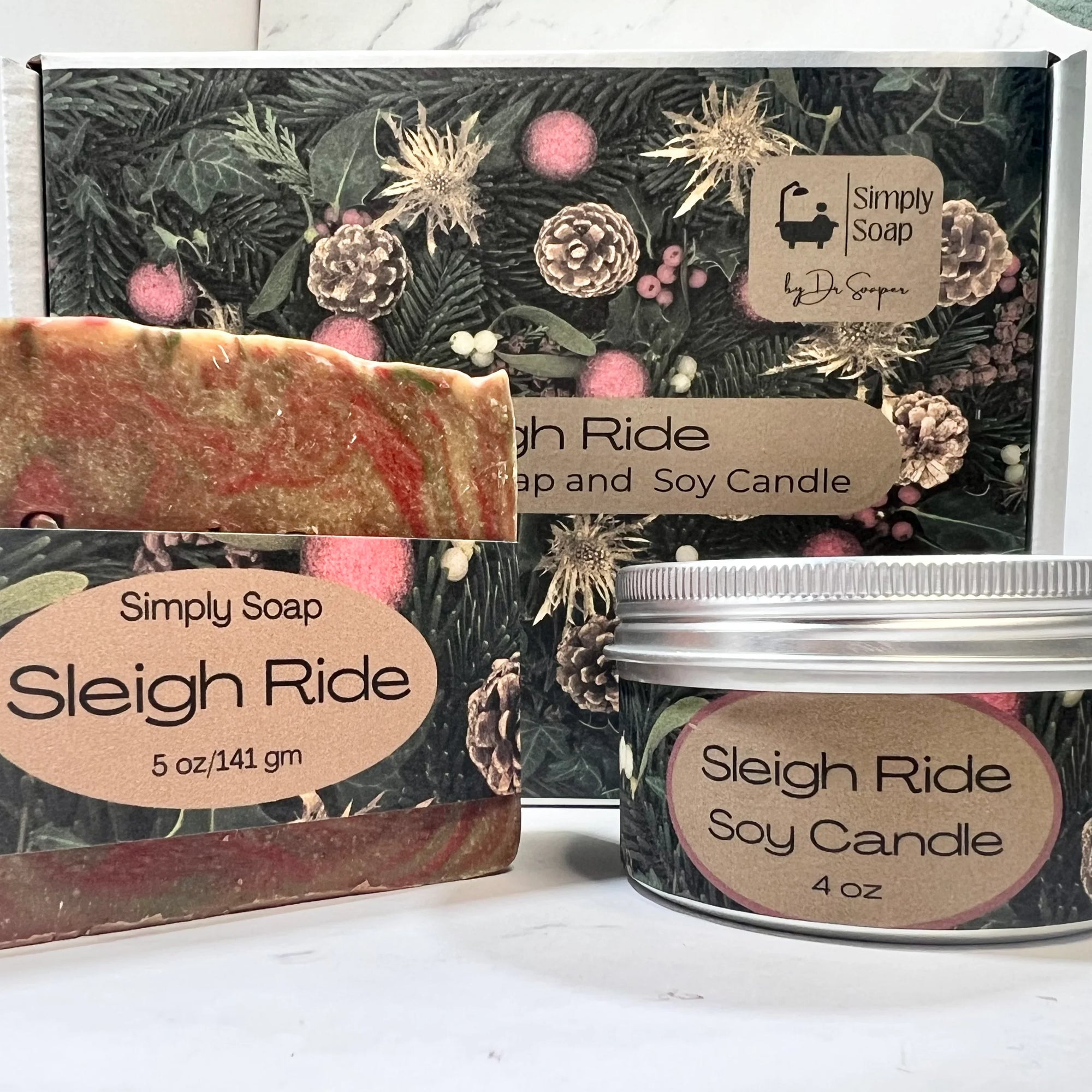 The image shows a Sleigh Ride Soap and Soy Candle set with packaging that has a Christmas-themed design, including a bar of soap and a candle with the product labels visible.