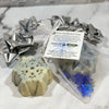 Snowflake-shaped soap with packaging on a marble surface