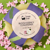 Simply Soap Bloom Essence  Solid Conditioner Bar on a floral background