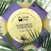 Island Breeze Solid Conditioner Bar with palm leaves in the background