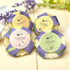 Four Simply Soap Solid conditioner bars with labels on a light  wood background with lavender flowers.