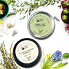 Solid shampoo and conditioner containers with herbs and flowers on a white background