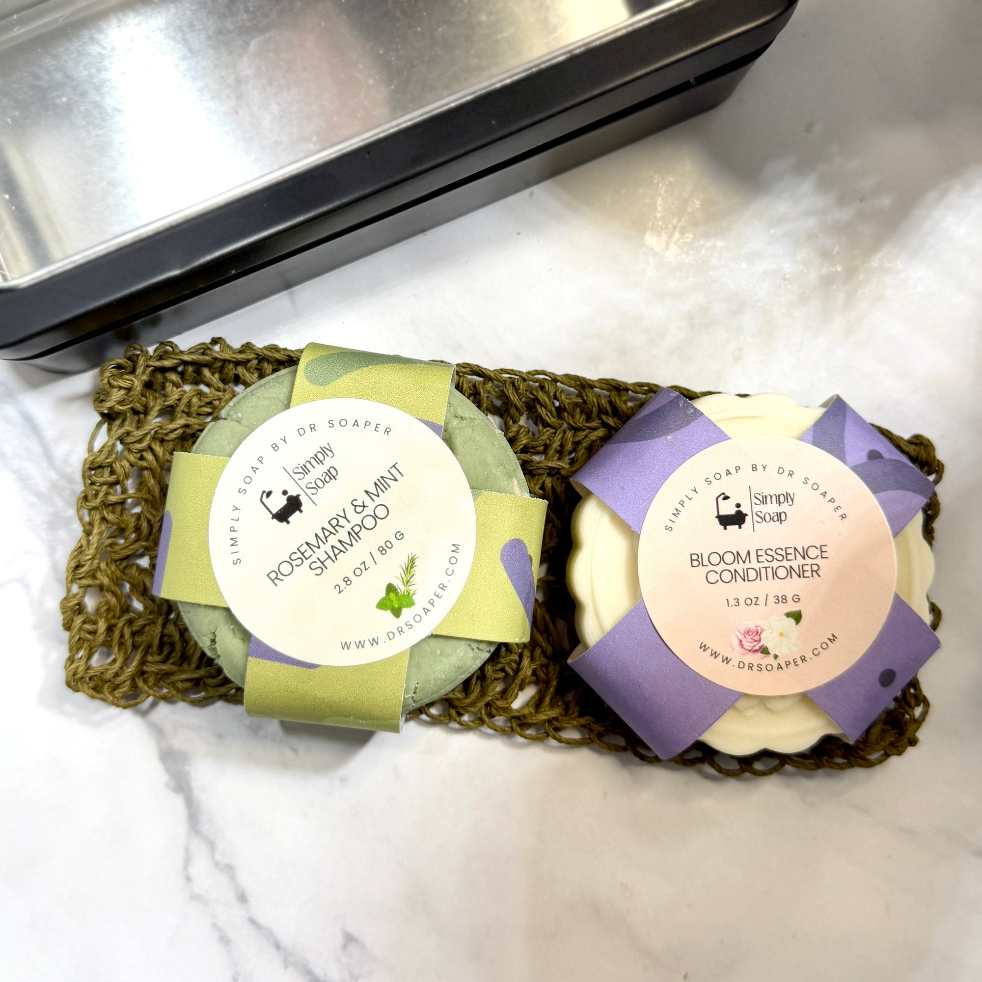 Solid shampoo and conditioner sitting on hemp soap lift