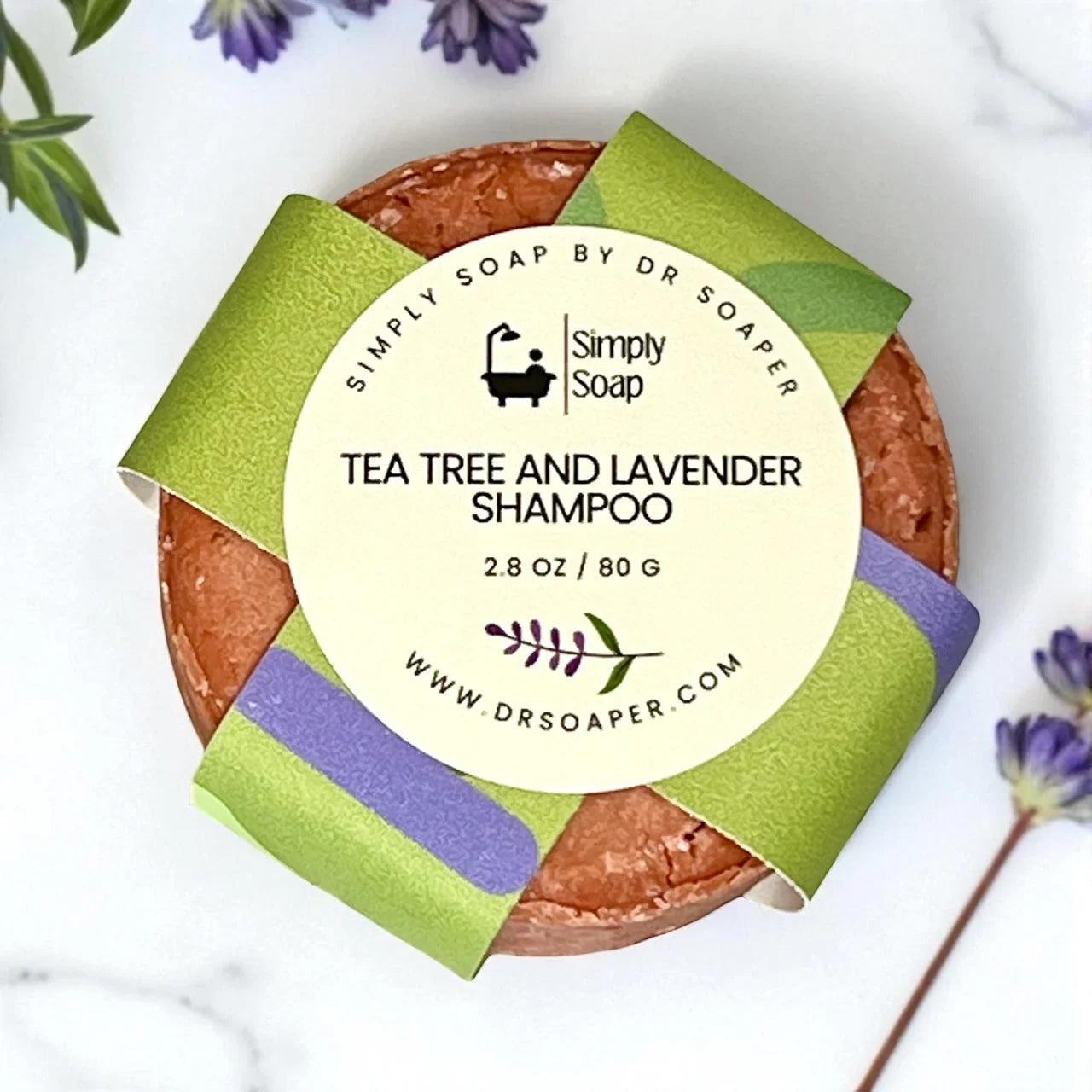 Tea tree and lavender shampoo bar on marble surface