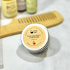 Simply Soap by Dr. Soaper Fresh and Fruity Conditioner jar with a wooden comb on a marble surface