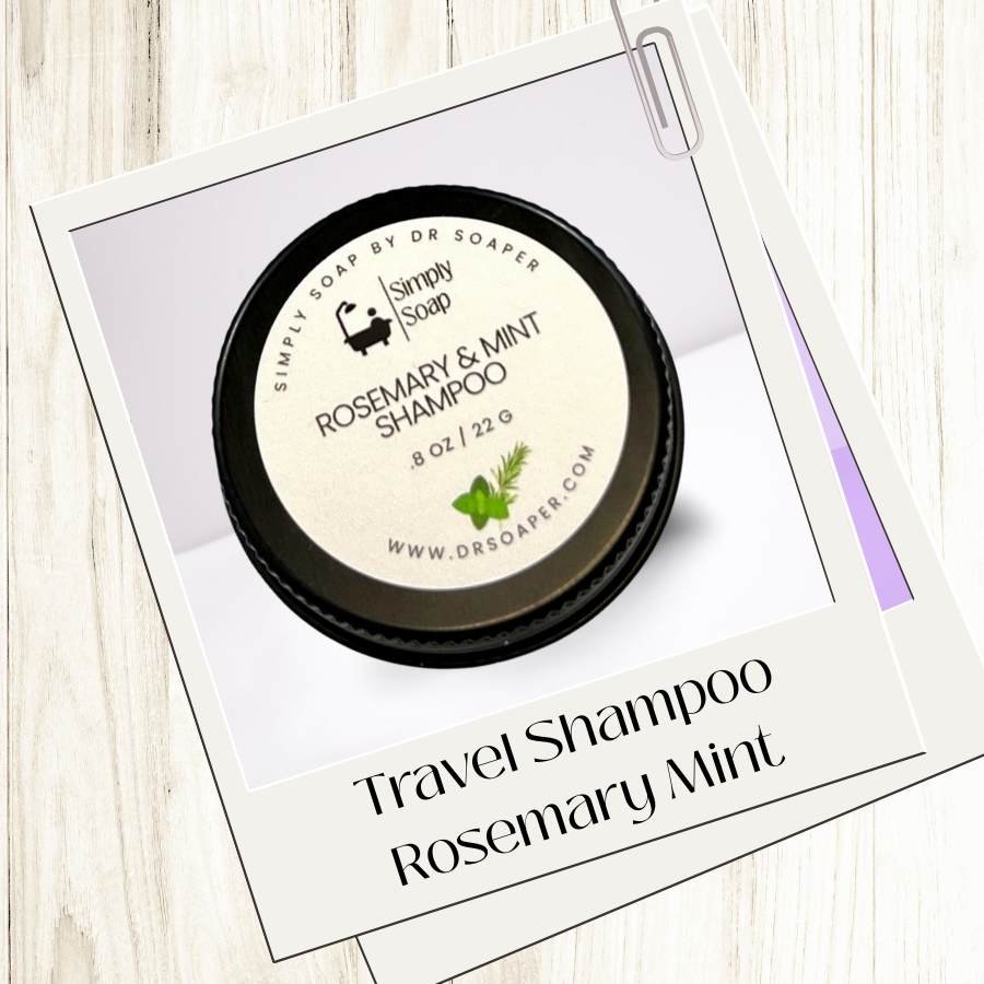 Travel-sized rosemary and mint shampoo bar with packaging on a wooden surface