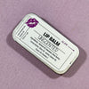 Unscented lip balm container with label on a purple background