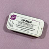 Lip balm container with 'Watermelon' flavor on a purple background