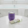 Simple Suds stainless tumbler with 2 bath salts, surrounded by light